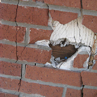 Smashed and damaged brickwork